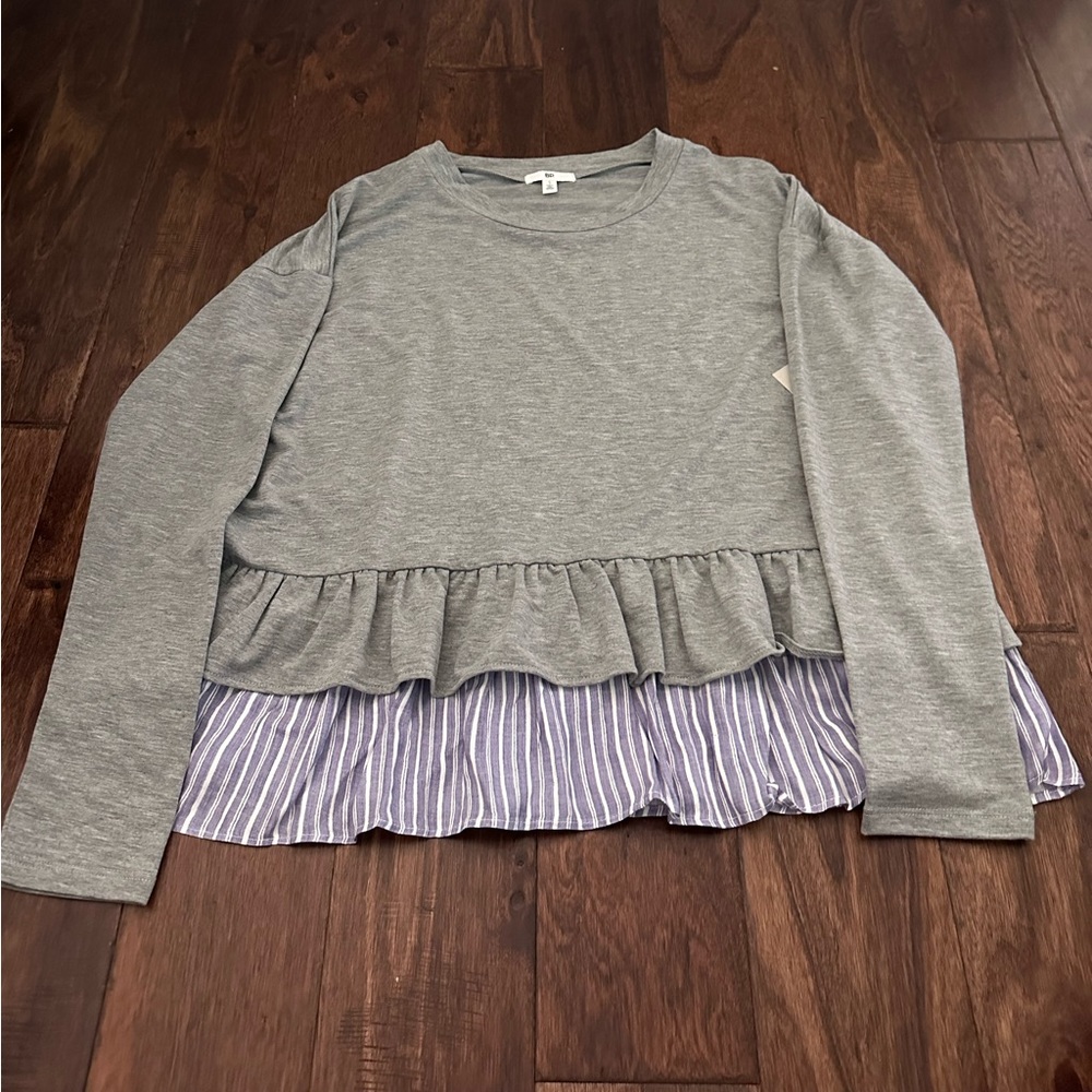 BP grey long sleeve with blue and white fringe on the bottom